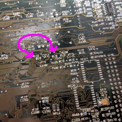 Photo of motherboard with arrows pointing to R151 and R152.